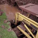 Madison Machinery Inc Over The Tire Tracks Chain Over-the-Tire Tracks (OTTs) for Skid Steers — Grizzly™